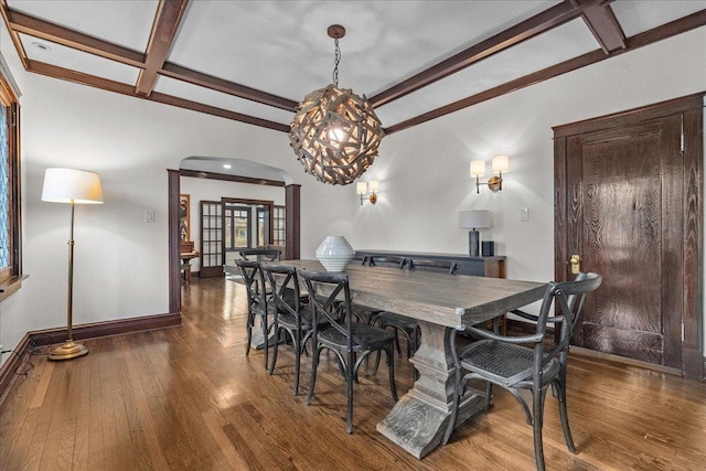 2087 W Greenleaf Ave, Chicago, IL 60645 - dining area featuring beam ceiling, coffered ceiling, wood finished floors, a chandelier, and baseboards