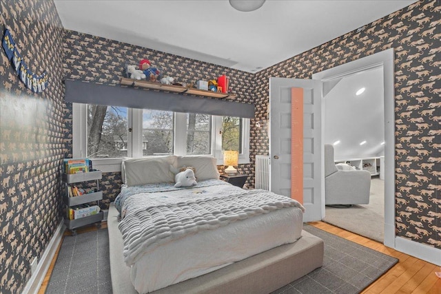 2087 W Greenleaf Ave, Chicago, IL 60645 - bedroom featuring wallpapered walls, baseboards, and wood finished floors