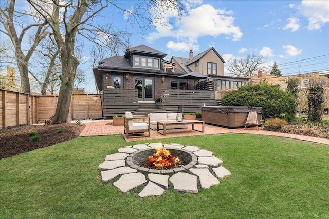 2087 W Greenleaf Ave, Chicago, IL 60645 - rear view of house featuring a hot tub, a fire pit, brick siding, and a patio area