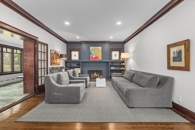 2087 W Greenleaf Ave, Chicago, IL 60645 - living room featuring wood finished floors, crown molding, a brick fireplace, recessed lighting, and baseboards