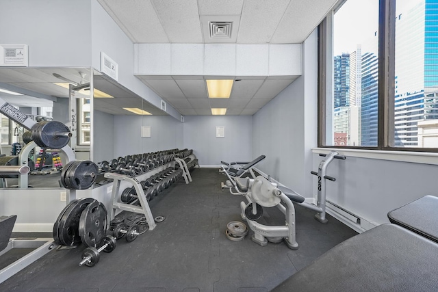 405 N Wabash Ave Unit 502, Chicago, IL 60611 - exercise room featuring a drop ceiling, a baseboard heating unit, and baseboards