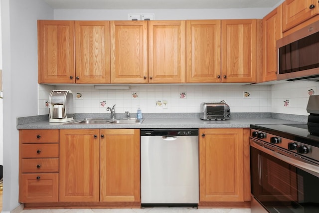 405 N Wabash Ave Unit 502, Chicago, IL 60611 - kitchen featuring stainless steel appliances, a sink, and tasteful backsplash