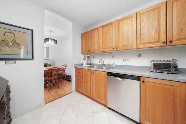 405 N Wabash Ave Unit 502, Chicago, IL 60611 - kitchen with dishwasher, a sink, decorative backsplash, and light countertops