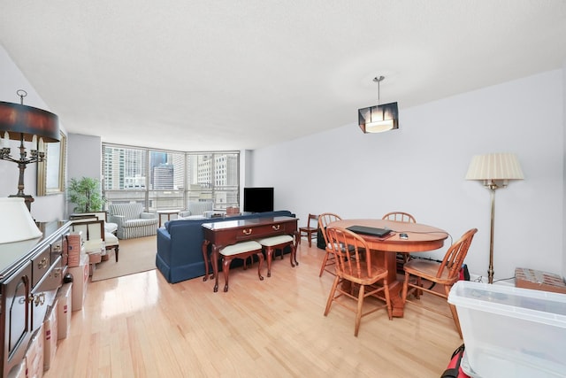 405 N Wabash Ave Unit 502, Chicago, IL 60611 - dining room with light wood finished floors and expansive windows