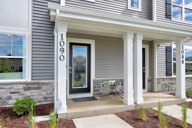 1062 58th Rd Unit 0051, Union Grove, WI 53182 - property entrance with a porch and stone siding