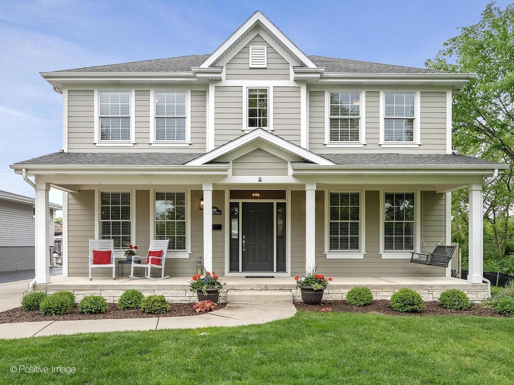 5437 Fair Elms Ave, Western Springs, IL 60558 - view of front of home featuring a porch, a front lawn, and roof with shingles