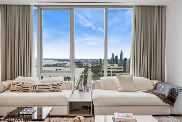 363 E Wacker Dr Unit 3703, Chicago, IL 60601 - living area with floor to ceiling windows, a water view, and a city view