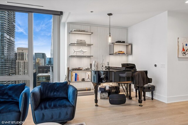 363 E Wacker Dr Unit 3703, Chicago, IL 60601 - living room featuring baseboards, wood finished floors, and a city view