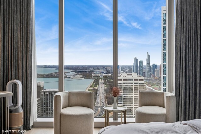 363 E Wacker Dr Unit 3703, Chicago, IL 60601 - bedroom with a view of city, wood finished floors, and a water view