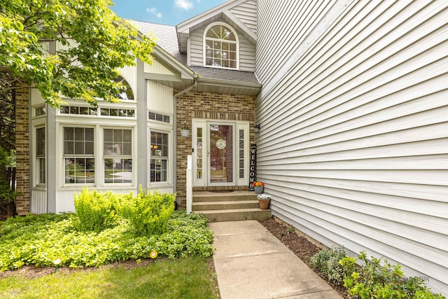 300 Knox Park Rd, Lake Zurich, IL 60047 - doorway to property featuring a shingled roof and brick siding