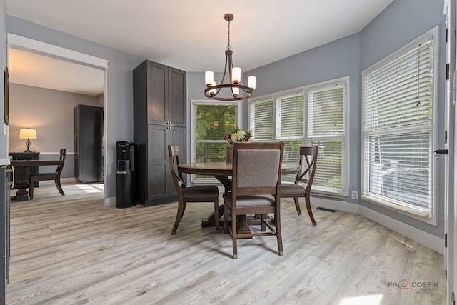 300 Knox Park Rd, Lake Zurich, IL 60047 - dining room featuring a chandelier and light wood-style flooring