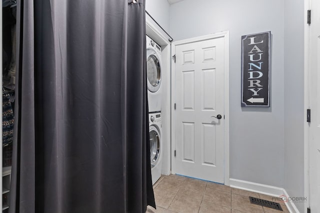 300 Knox Park Rd, Lake Zurich, IL 60047 - laundry area with estacked washer and dryer and light tile patterned flooring