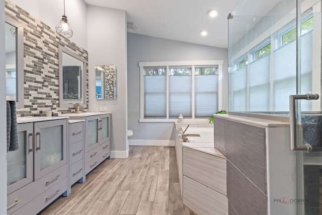 300 Knox Park Rd, Lake Zurich, IL 60047 - full bathroom featuring vanity, lofted ceiling, a bath, wood finished floors, and recessed lighting