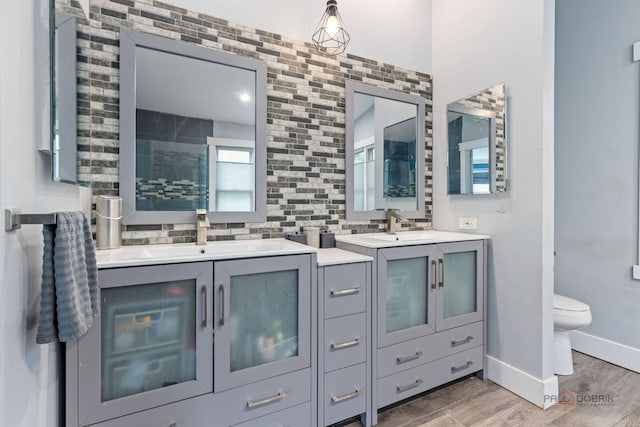 300 Knox Park Rd, Lake Zurich, IL 60047 - full bathroom with two vanities, wood finished floors, and a tile shower