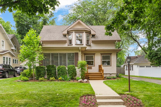 310 Forest Ave, Glen Ellyn, IL 60137 - view of front of home featuring a front yard, a shingled roof, and stucco siding
