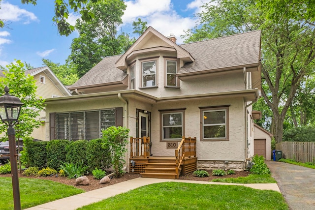 310 Forest Ave, Glen Ellyn, IL 60137 - victorian home with roof with shingles, stucco siding, and a chimney