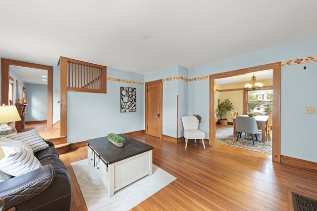 310 Forest Ave, Glen Ellyn, IL 60137 - living room featuring a chandelier and light wood finished floors
