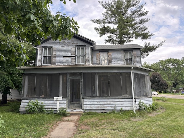 218 S Washington St, Lacon, IL 61540 - view of front of home featuring a sunroom and a front yard