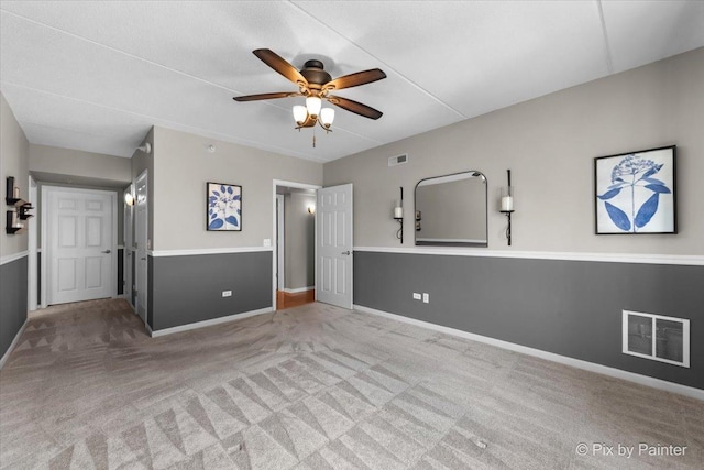1327 Brown St Unit 206, Des Plaines, IL 60016 - unfurnished living room featuring carpet flooring, a ceiling fan, and baseboards