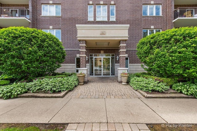1327 Brown St Unit 206, Des Plaines, IL 60016 - view of exterior entry featuring brick siding