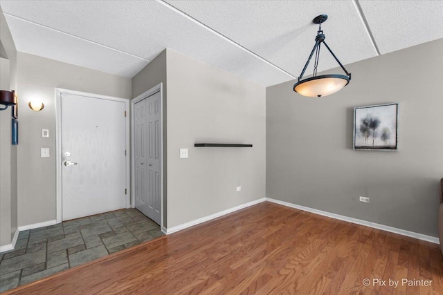 1327 Brown St Unit 206, Des Plaines, IL 60016 - entrance foyer with baseboards, a textured ceiling, and wood finished floors
