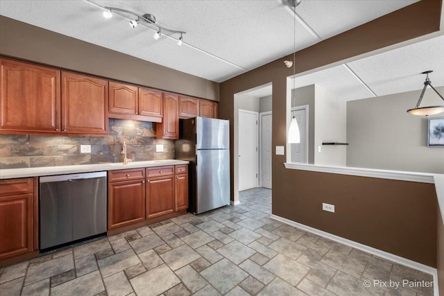 1327 Brown St Unit 206, Des Plaines, IL 60016 - kitchen with stainless steel appliances, backsplash, baseboards, light countertops, and light stone finish flooring