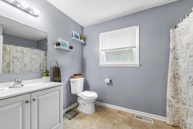 201 N First St, Wilmington, IL 60481 - bathroom featuring toilet, vanity, and baseboards