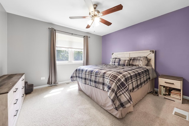 201 N First St, Wilmington, IL 60481 - bedroom featuring baseboards, light carpet, and ceiling fan