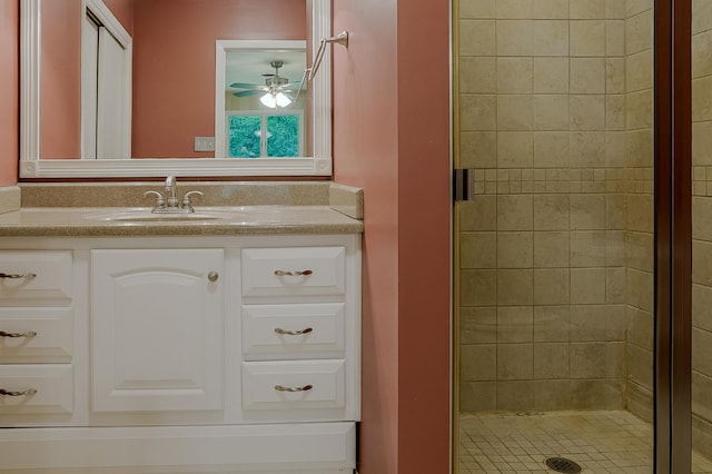 full bath featuring a shower stall, ceiling fan, and vanity
