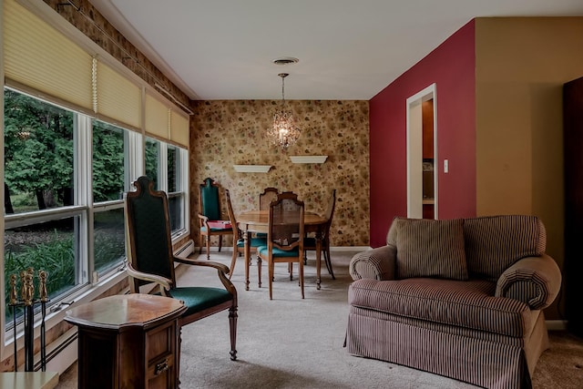 carpeted living room with a chandelier