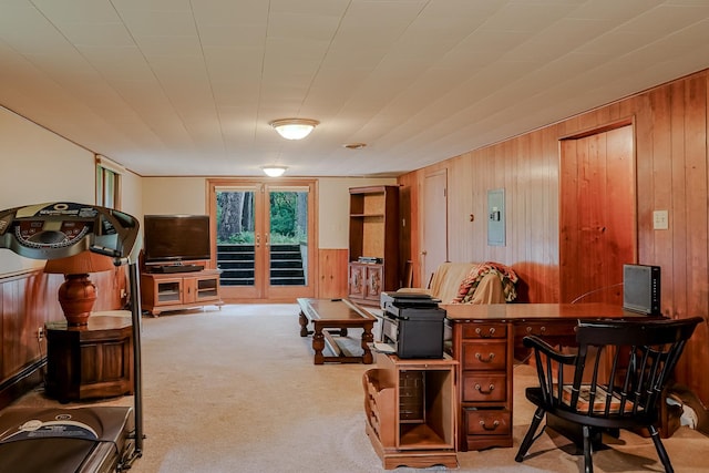 home office featuring wooden walls, carpet flooring, and electric panel