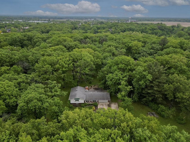 view from above of property featuring a heavily wooded area