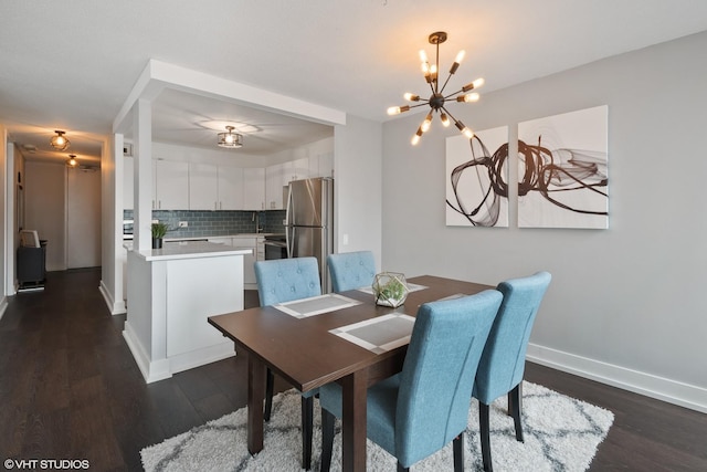 405 N Wabash Ave Unit 713, Chicago, IL 60611 - dining room featuring a chandelier, dark wood finished floors, and baseboards