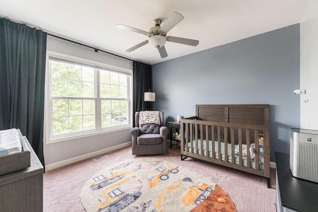 86 E Hummingbird Ave, Cortland, IL 60112 - carpeted bedroom with multiple windows, baseboards, a crib, and ceiling fan