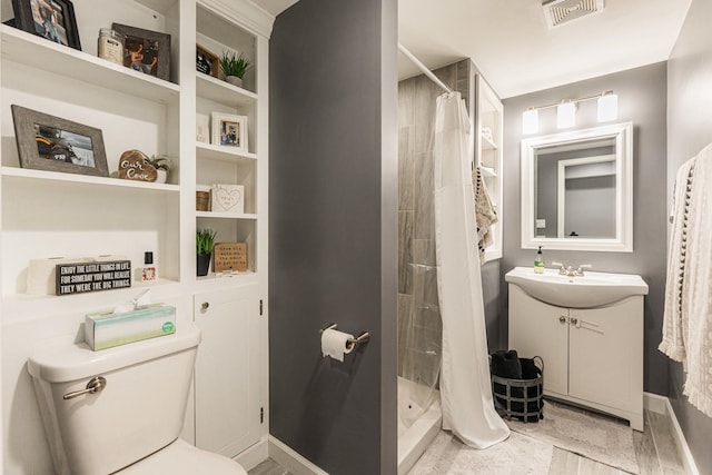 86 E Hummingbird Ave, Cortland, IL 60112 - bathroom with vanity, a shower stall, toilet, and baseboards