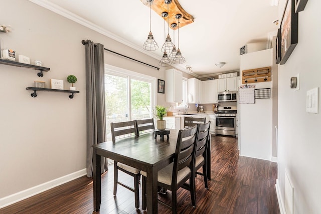 86 E Hummingbird Ave, Cortland, IL 60112 - dining area featuring crown molding, dark wood-type flooring, and baseboards