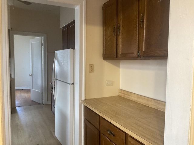 6832 S S Shore Dr Unit 1, Chicago, IL 60649 - kitchen with freestanding refrigerator, light wood-style flooring, ceiling fan, and light countertops