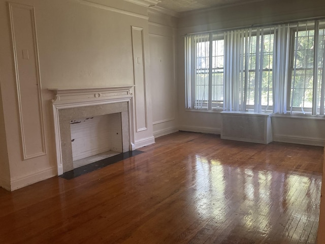 6832 S S Shore Dr Unit 1, Chicago, IL 60649 - unfurnished living room with healthy amount of natural light, wood finished floors, and crown molding