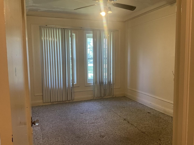 6832 S S Shore Dr Unit 1, Chicago, IL 60649 - spare room featuring carpet, a ceiling fan, and crown molding