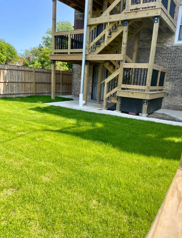 1110 W Marquette Rd, Chicago, IL 60621 - rear view of house featuring stairs, a patio area, and stone siding