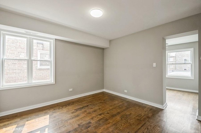 2553 W Summerdale St Unit 2E, Chicago, IL 60625 - spare room with dark wood finished floors and baseboards