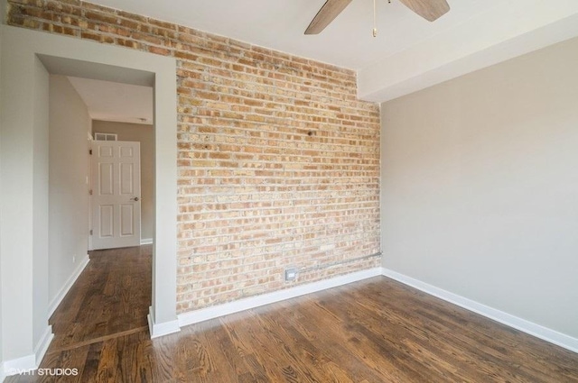 2553 W Summerdale St Unit 2E, Chicago, IL 60625 - unfurnished room with brick wall, wood finished floors, baseboards, and a ceiling fan