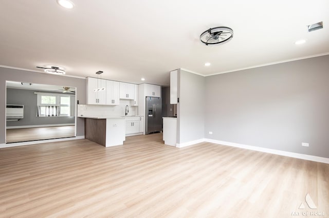 16568 Plainview Dr, Markham, IL 60428 - unfurnished living room with a sink, crown molding, light wood-style floors, baseboards, and recessed lighting