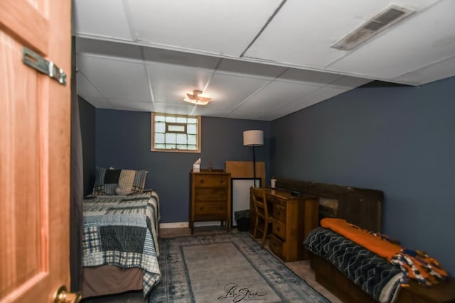 905 Kelly Ave, Joliet, IL 60435 - carpeted bedroom featuring a paneled ceiling and baseboards