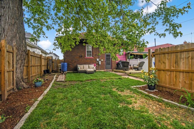 905 Kelly Ave, Joliet, IL 60435 - view of yard featuring an outdoor living space, a patio, and central AC