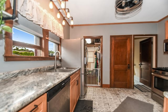 905 Kelly Ave, Joliet, IL 60435 - kitchen featuring appliances with stainless steel finishes, a sink, crown molding, baseboards, and brown cabinets