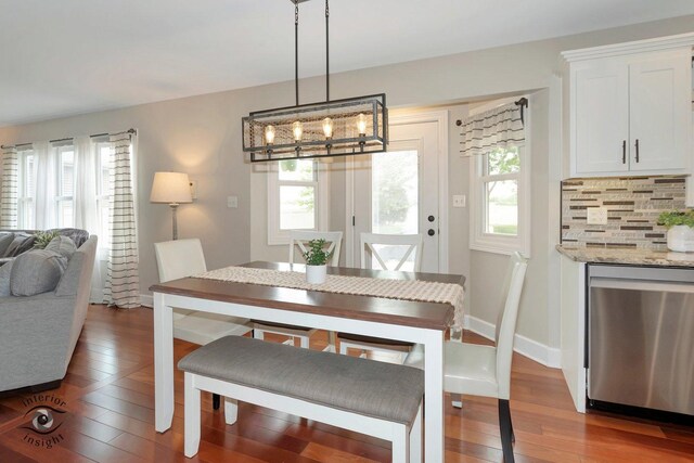 883 White Tail Bnd, Manteno, IL 60950 - dining area featuring plenty of natural light, hardwood / wood-style flooring, baseboards, and a chandelier