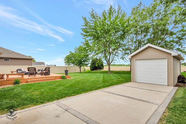 883 White Tail Bnd, Manteno, IL 60950 - view of yard with a deck, an outbuilding, a garage, driveway, and an outdoor living space