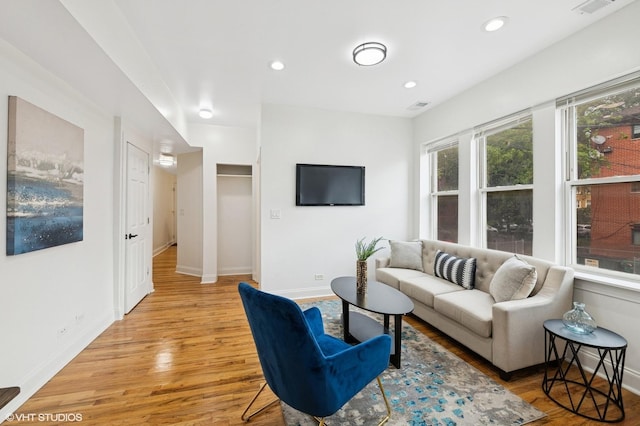 3849 W Ainslie St Unit 1, Chicago, IL 60625 - living room featuring light wood-style floors, baseboards, and recessed lighting