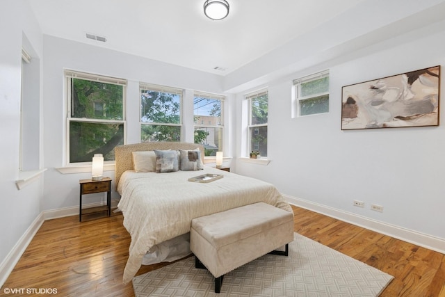 3849 W Ainslie St Unit 1, Chicago, IL 60625 - bedroom with baseboards and wood finished floors